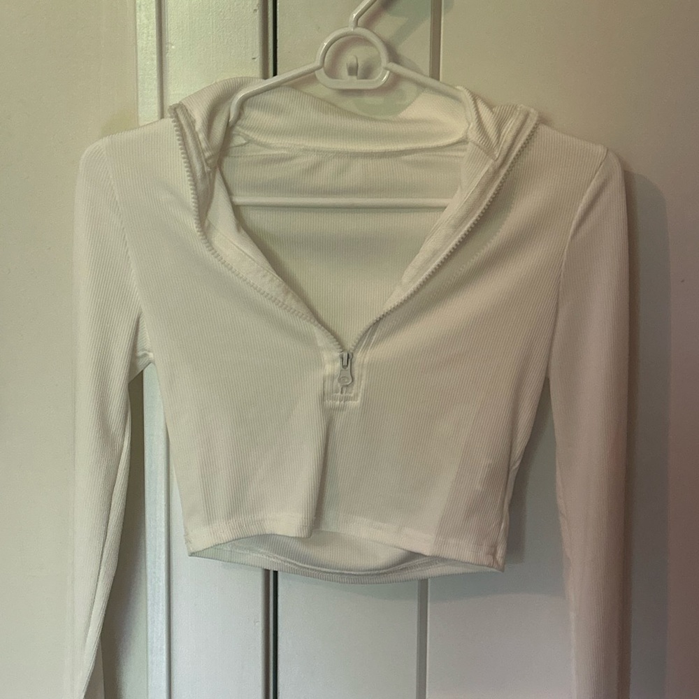 Cream long sleeve with zipper. Very comfy and can wear with anything